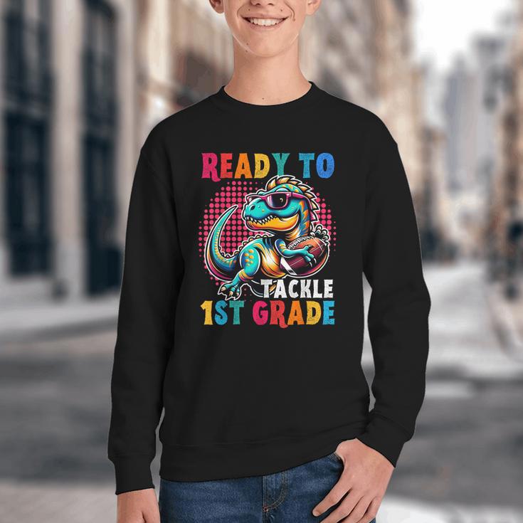 First Day Back To School 1st Grade Boys Football Dinosaur Youth Crewneck Sweatshirt