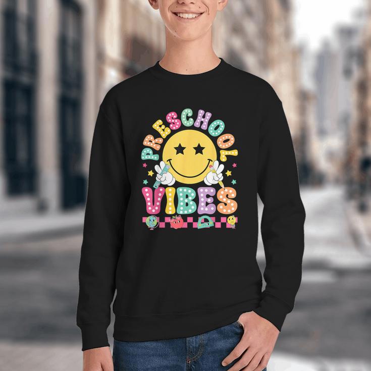 Preschool Vibes Smile Face Back To School Kinder Girls Kids Youth Crewneck Sweatshirt Preschool Vibes Smile Face Back To School Kinder Girls Kids Youth Crewneck Sweatshirt