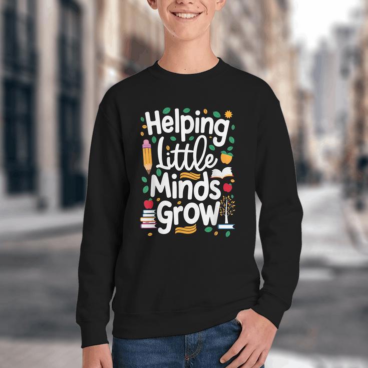 Women's Helping Little Minds Grow Back To School Apparel Youth Crewneck Sweatshirt Women's Helping Little Minds Grow Back To School Apparel Youth Crewneck Sweatshirt