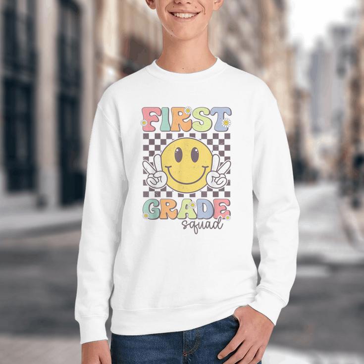 First Grade Squad Smile Face 1st Grade Back To School Youth Crewneck Sweatshirt First Grade Squad Smile Face 1st Grade Back To School Youth Crewneck Sweatshirt