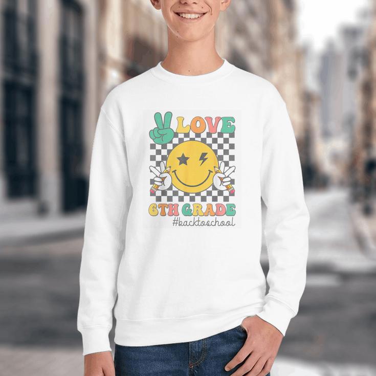 Peace Love 6th Grade Smile Face Back To School Sixth Grade Youth Crewneck Sweatshirt Peace Love 6th Grade Smile Face Back To School Sixth Grade Youth Crewneck Sweatshirt