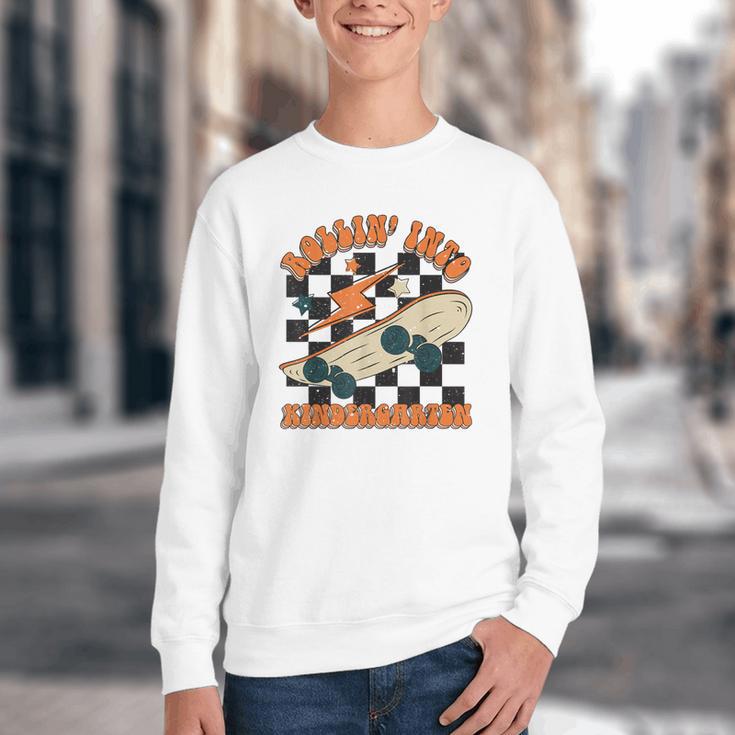 Rolling Into Kindergarten Retro Groovy Back To School Kids Youth Crewneck Sweatshirt