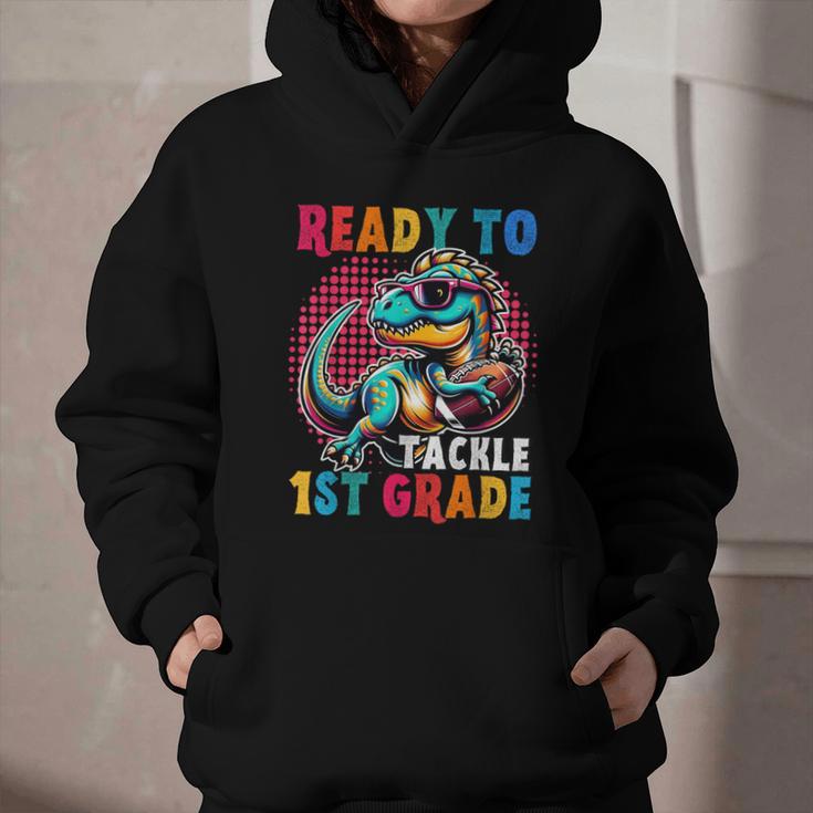 First Day Back To School 1st Grade Boys Football Dinosaur Graphic Youth Hoodie First Day Back To School 1st Grade Boys Football Dinosaur Graphic Youth Hoodie