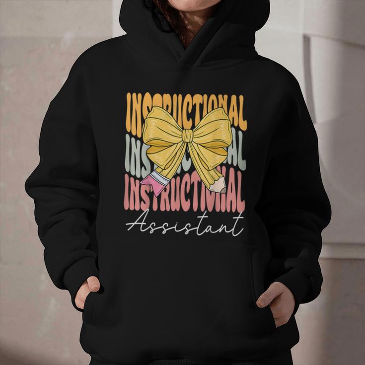 Instructional Assistant Groovy Coquette Bow Back To School Graphic Youth Hoodie Instructional Assistant Groovy Coquette Bow Back To School Graphic Youth Hoodie