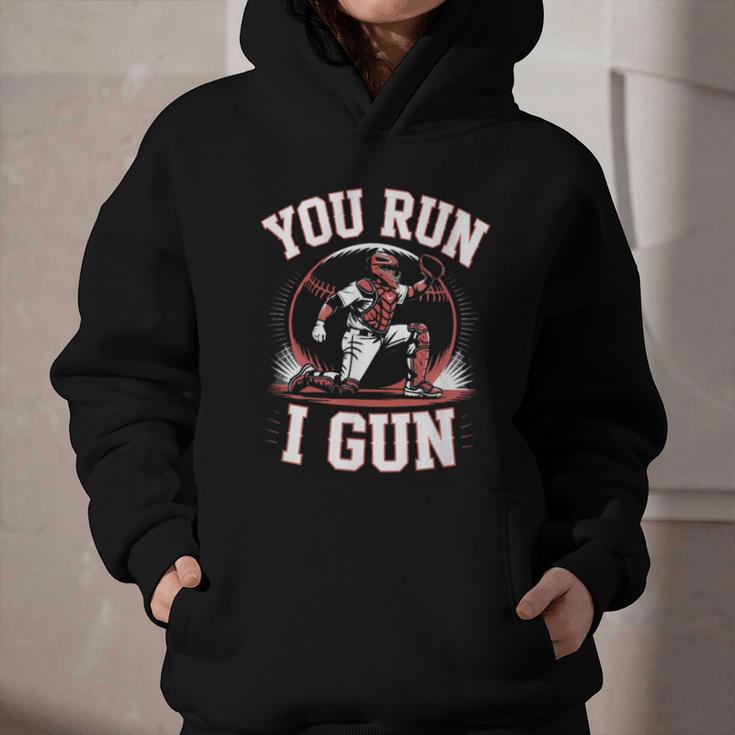 You Run I Gun Baseball Catcher Softball Player Graphic Youth Hoodie You Run I Gun Baseball Catcher Softball Player Graphic Youth Hoodie