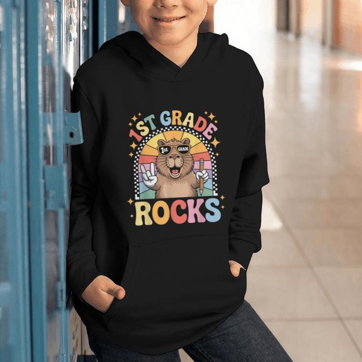 Back To School 1st Grade Capybara First Grade Rocks Graphic Youth Hoodie Back To School 1st Grade Capybara First Grade Rocks Graphic Youth Hoodie