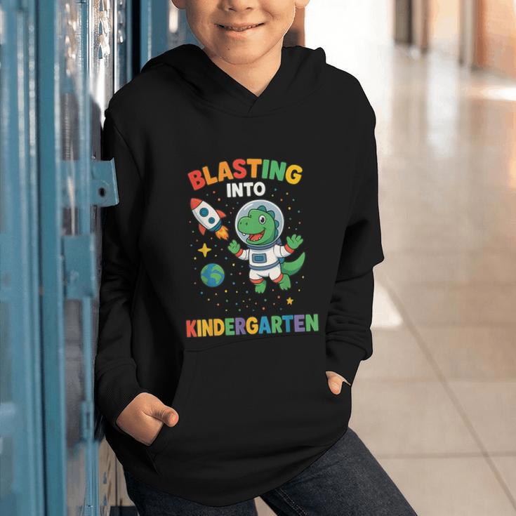 Blasting Into Kindergarten Dinosaur Astronaut Back To School Graphic Youth Hoodie Blasting Into Kindergarten Dinosaur Astronaut Back To School Graphic Youth Hoodie