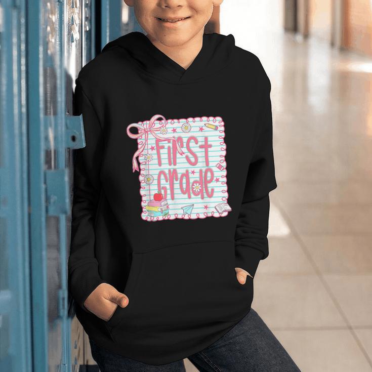 First Grade Coquette Bow Pink Preppy Back To School Girls Graphic Youth Hoodie First Grade Coquette Bow Pink Preppy Back To School Girls Graphic Youth Hoodie