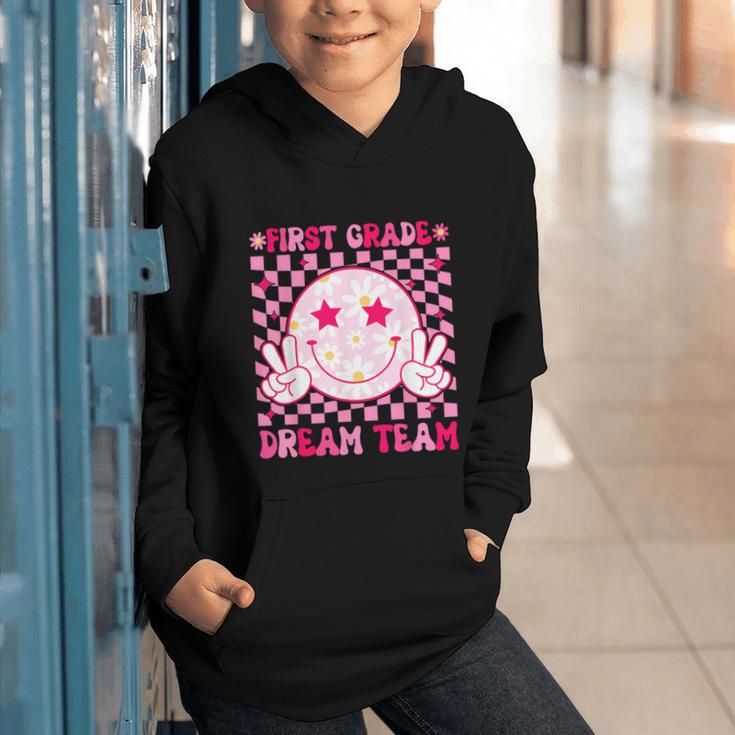 Groovy First Grade Dream Team Back To School 1st Grade Squad Graphic Youth Hoodie Groovy First Grade Dream Team Back To School 1st Grade Squad Graphic Youth Hoodie
