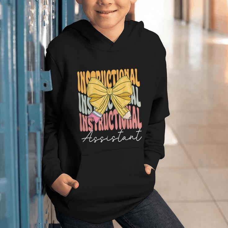 Instructional Assistant Groovy Coquette Bow Back To School Graphic Youth Hoodie Instructional Assistant Groovy Coquette Bow Back To School Graphic Youth Hoodie
