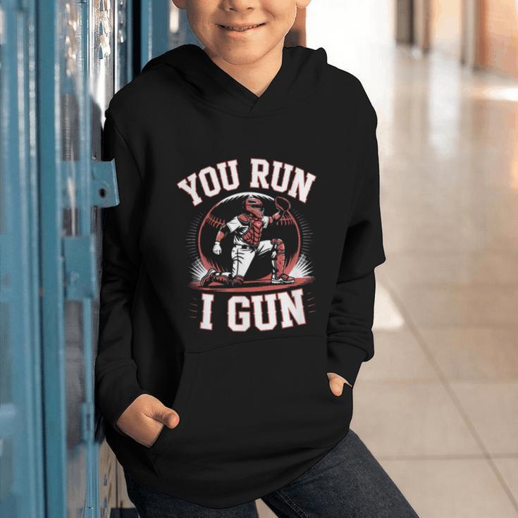 You Run I Gun Baseball Catcher Softball Player Graphic Youth Hoodie You Run I Gun Baseball Catcher Softball Player Graphic Youth Hoodie