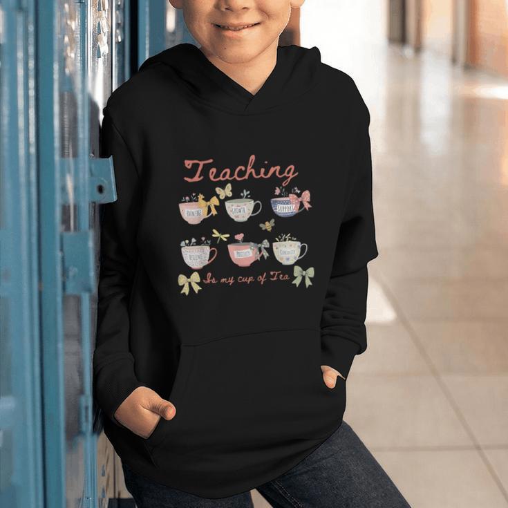 Teaching Is My Cup Of Tea Coquette Bow Floral Back To School Graphic Youth Hoodie Teaching Is My Cup Of Tea Coquette Bow Floral Back To School Graphic Youth Hoodie