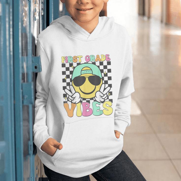 1st Grade Vibes Smile Face Back To School First Grade Graphic Youth Hoodie 1st Grade Vibes Smile Face Back To School First Grade Graphic Youth Hoodie