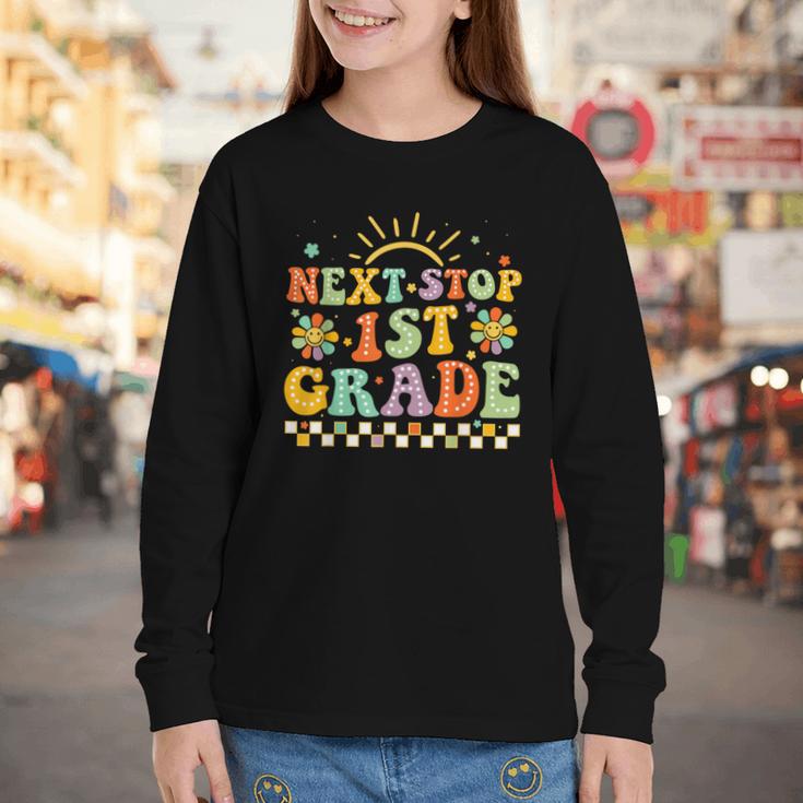 Next Stop 1st Grade Groovy Retro First Grade Back To School Youth Long Sleeve Tee Next Stop 1st Grade Groovy Retro First Grade Back To School Youth Long Sleeve Tee
