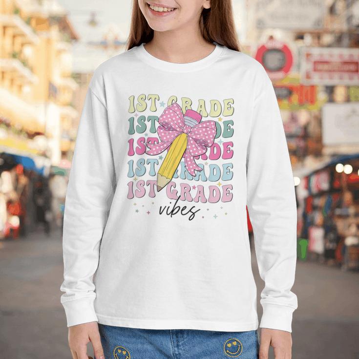 1st Grade Vibes Girl Coquette Bow First Grade Back To School Youth Long Sleeve Tee 1st Grade Vibes Girl Coquette Bow First Grade Back To School Youth Long Sleeve Tee