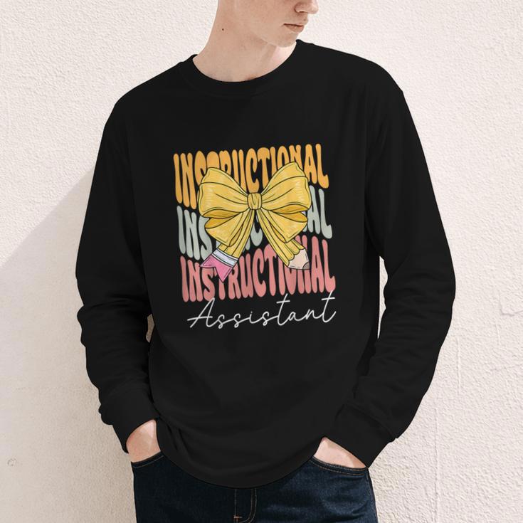 Instructional Assistant Groovy Coquette Bow Back To School Youth Long Sleeve Tee Instructional Assistant Groovy Coquette Bow Back To School Youth Long Sleeve Tee