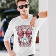 Dentalibes 歯 ピンク ヒョウ柄 弓 歯科医 長袖Tシャツ 彼への贈り物