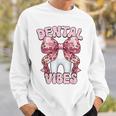 Dentalibes 歯 ピンク ヒョウ柄 弓 歯科医 スウェットシャツ 彼への贈り物
