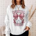 Dentalibes 歯 ピンク ヒョウ柄 弓 歯科医 スウェットシャツ 彼女への贈り物