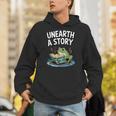 Unearth a Story Frog Reading a Book Summer 2026 Unisex Hoodie Unearth a Story Frog Reading a Book Summer 2026 Unisex Hoodie