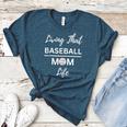 Living That Baseball Mom Life Women's Heather T-Shirt Heather Deep Teal Living That Baseball Mom Life Women's Heather T-Shirt Heather Deep Teal