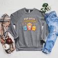 Pop Open A Good Book For School Librarian Popcorn Raglan Sleeve Sweatshirt Deep Heather Pop Open A Good Book For School Librarian Popcorn Raglan Sleeve Sweatshirt Deep Heather