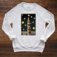 Astrologist Sitting On The Tower Of Stacked Up Books Starry Raglan Sleeve Sweatshirt Heather Mustard