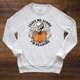 Leave Me Alone I'm Reading Skeleton Reading Book Bookish Raglan Sleeve Sweatshirt Heather Mustard