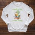 Women's Unearth a Story Triceratops Dinosaur Reading Books Cute Dino Raglan Sleeve Sweatshirt Heather Mustard