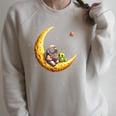 Astronaut Reading Book To Alien Moon Space Astronomy Raglan Sleeve Sweatshirt Heather Forest