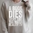 A Book Dies Every Time You Watch Reality Tv Raglan Sleeve Sweatshirt Heather Forest