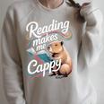 Book Lover Reading Makes Me Cappy Pun Capybara Reading Raglan Sleeve Sweatshirt Heather Forest