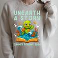 Book Sea Turtle Summer Reading 2026 Unearth a Story Raglan Sleeve Sweatshirt Heather Forest