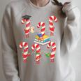 Bookmas Christmas Books Shirt Candy Cane Bookworm Raglan Sleeve Sweatshirt Heather Forest