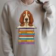 Cute Basset Hound Dog Reading On Pile Of Books Raglan Sleeve Sweatshirt Heather Forest