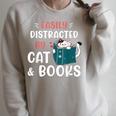 Easily Distracted By Cats And Books Cat & Book Lover For Men Women Kids Raglan Sleeve Sweatshirt Heather Forest