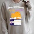 Easily Distracted Cats And Books Cute Cat Book Lover Raglan Sleeve Sweatshirt Heather Forest