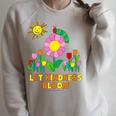 Eric Carle Let Kindness Bloom Flowers And Caterpillar Book Raglan Sleeve Sweatshirt Heather Forest Eric Carle Let Kindness Bloom Flowers And Caterpillar Book Raglan Sleeve Sweatshirt Heather Forest