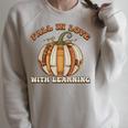 Fall In Love With Learning Books Pumpkin Autum Thanksgiving Raglan Sleeve Sweatshirt Heather Forest