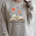 Floral Book A New Chapter Begins Retired Teacher Retirement Raglan Sleeve Sweatshirt Heather Forest