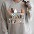 Halloween Library Ghost Books Teacher Spooky Trick Or Teach Raglan Sleeve Sweatshirt Heather Forest