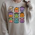Halloween Monsters Reading Books Pattern Spooky Kawaii Anime Premium Tri-Blend Raglan Sleeve Sweatshirt Heather Forest