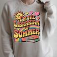 I'm The Librarian Of Summer Groovy Rainbow Retro Book Lover Raglan Sleeve Sweatshirt Heather Forest I'm The Librarian Of Summer Groovy Rainbow Retro Book Lover Raglan Sleeve Sweatshirt Heather Forest