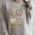 Love Unearth a Story Summer Reading 2026 Dino Skeleton Book Raglan Sleeve Sweatshirt Heather Forest