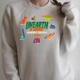 Summer Reading 2026 Unearth A Story Dinosaurs Book Lover Raglan Sleeve Sweatshirt Heather Forest Summer Reading 2026 Unearth A Story Dinosaurs Book Lover Raglan Sleeve Sweatshirt Heather Forest