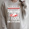 Never Underestimate Published Author Novelist Book Author Raglan Sleeve Sweatshirt Heather Forest