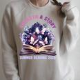 Unearth a Story Summer Library Reading 2026 Butterfly Book Raglan Sleeve Sweatshirt Heather Forest Unearth a Story Summer Library Reading 2026 Butterfly Book Raglan Sleeve Sweatshirt Heather Forest