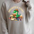 Unearth A Story Summer Reading 2026 Dinosaur Book Floral Raglan Sleeve Sweatshirt Heather Forest Unearth A Story Summer Reading 2026 Dinosaur Book Floral Raglan Sleeve Sweatshirt Heather Forest