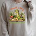 Unearth A Story Summer Reading 2026 Dinosaur Reading Books Raglan Sleeve Sweatshirt Heather Forest