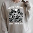 Weird Teachers Build Character Skeleton Reading Book Raglan Sleeve Sweatshirt Heather Forest